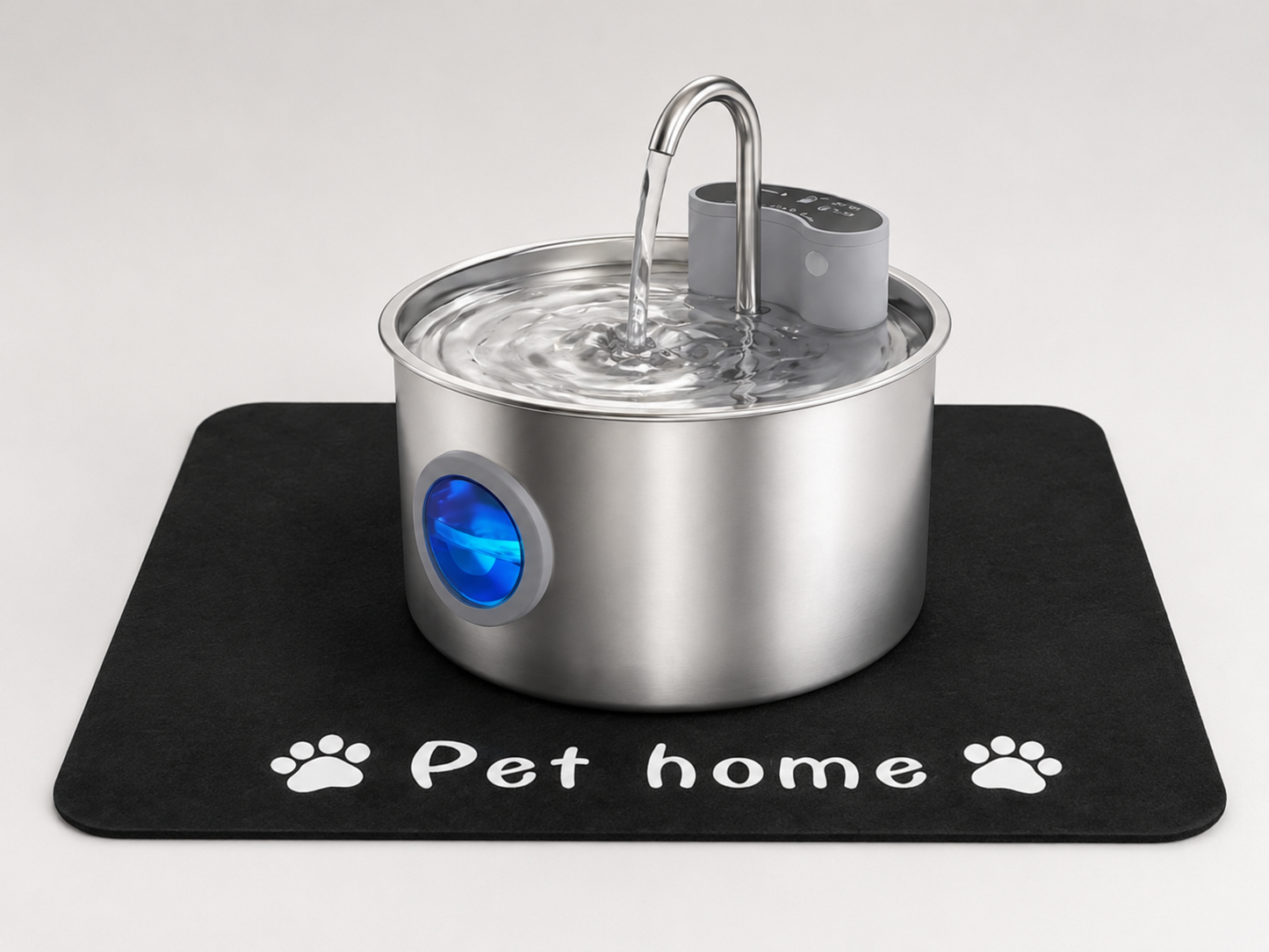 A complete cat fountain set, including a cat fountain and a water-absorbent mat.